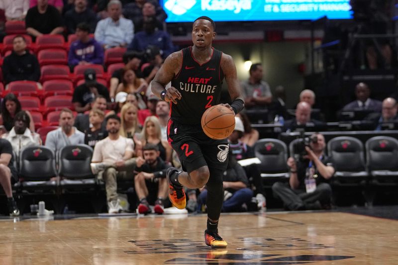 MIAMI, FL - MARCH 13: Terry Rozier #2 of the Miami Heat dribbles the ball during the game against the Denver Nuggets on March 13, 2024 at Kaseya Center in Miami, Florida. NOTE TO USER: User expressly acknowledges and agrees that, by downloading and or using this Photograph, user is consenting to the terms and conditions of the Getty Images License Agreement. Mandatory Copyright Notice: Copyright 2024 NBAE (Photo by Eric Espada/NBAE via Getty Images)