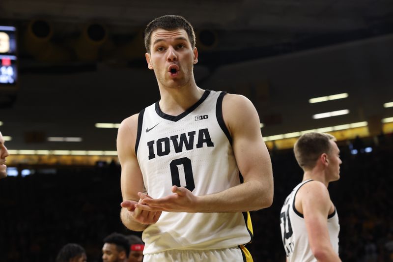 Jan 15, 2023; Iowa City, Iowa, USA; Iowa Hawkeyes forward Filip Rebraca (0) talks to the official during their game against the Maryland Terrapins at Carver-Hawkeye Arena. Mandatory Credit: Reese Strickland-USA TODAY Sports