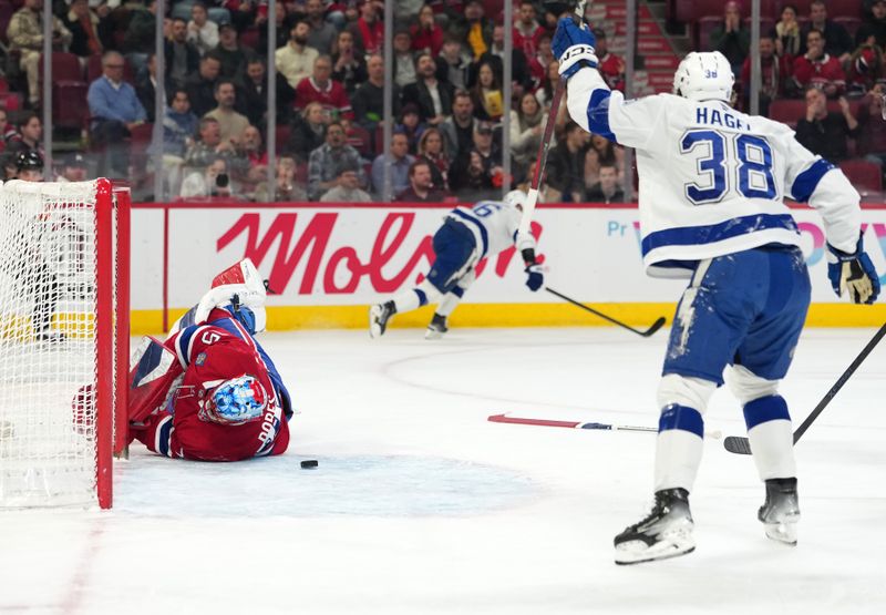 Dec 9, 2025; Montreal, Quebec, CAN; Tampa Bay Lightning forward Nikita Kucherov (86) scores a goal against Montreal Canadiens goalie Jakub Dobes (75) during the first period at the Bell Centre. Mandatory Credit: Eric Bolte-Imagn Images