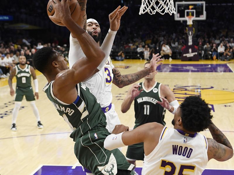 LOS ANGELES, CALIFORNIA - OCTOBER 15: Anthony Davis #3 of the Los Angeles Lakers defends Giannis Antetokounmpo #34 of the Milwaukee Bucks during the first half of a preseason basketball game at Crypto.com Arena on October 15, 2023 in Los Angeles, California. NOTE TO USER: User expressly acknowledges and agrees that, by downloading and or using this photograph, User is consenting to the terms and conditions of the Getty Images License Agreement. (Photo by Kevork Djansezian/Getty Images)