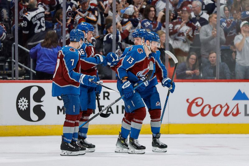 Mar 22, 2024; Denver, Colorado, USA; Colorado Avalanche right wing Valeri Nichushkin (13) celebrates with defenseman Devon Toews (7) and right wing Mikko Rantanen (96) and center Casey Mittelstadt (37) after his goal in the third period against the Columbus Blue Jackets at Ball Arena. Mandatory Credit: Isaiah J. Downing-USA TODAY Sports