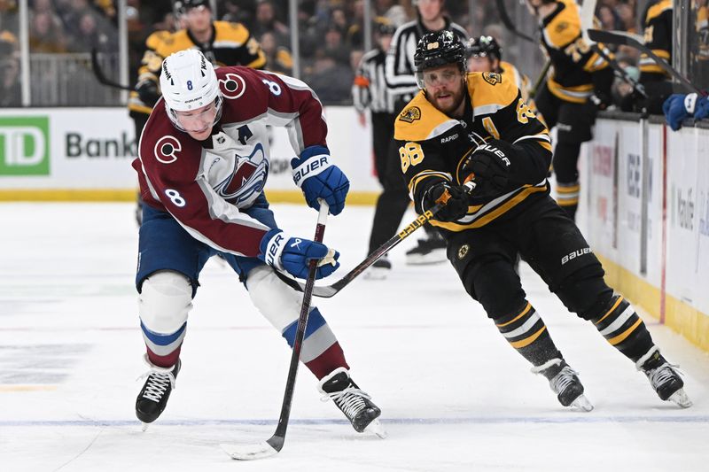 Jan 25, 2025; Boston, Massachusetts, USA; Boston Bruins right wing David Pastrnak (88) defends Colorado Avalanche defenseman Cale Makar (8) during the third period at the TD Garden. Mandatory Credit: Brian Fluharty-Imagn Images