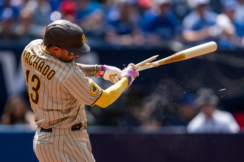 Jul 20, 2023; Toronto, Ontario, CAN; San Diego Padres third baseman Manny Machado (13) cracks his bat during the sixth inning against the Toronto Blue Jays at Rogers Centre. Mandatory Credit: Kevin Sousa-USA TODAY Sports