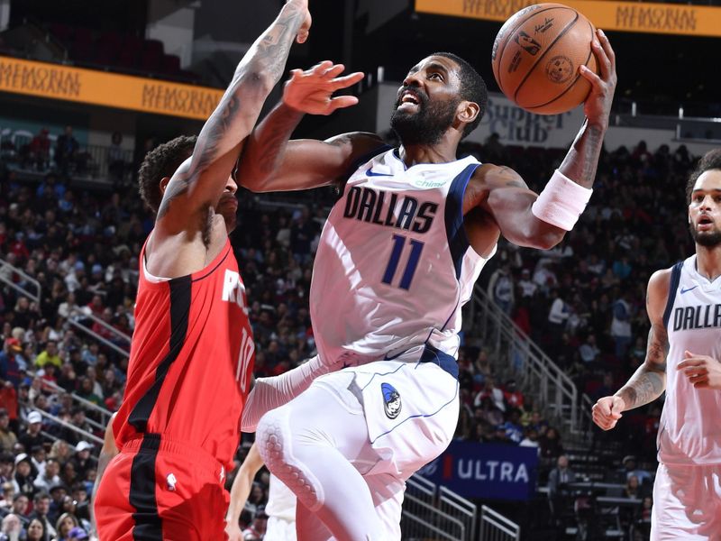 HOUSTON, TX - JANUARY 01   Kyrie Irving #11 of the Dallas Mavericks shoots the ball during the game against the Houston Rockets on January 01, 2025 at the Toyota Center in Houston, Texas. NOTE TO USER: User expressly acknowledges and agrees that, by downloading and or using this photograph, User is consenting to the terms and conditions of the Getty Images License Agreement. Mandatory Copyright Notice: Copyright 2025 NBAE (Photo by Logan Riely/NBAE via Getty Images)