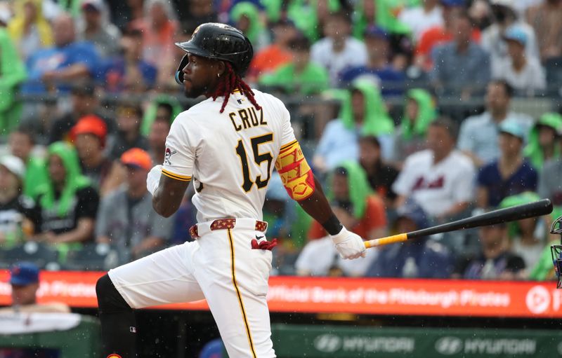 Jun 28, 2025; Pittsburgh, Pennsylvania, USA; Pittsburgh Pirates center fielder Oneil Cruz (15) hits a single against the New York Mets during the second inning at PNC Park. Mandatory Credit: Charles LeClaire-Imagn Images