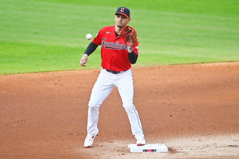 Sep 2, 2023; Cleveland, Ohio, USA; Cleveland Guardians second baseman Andres Gimenez (0) catches a throw against the Tampa Bay Rays in the first inning at Progressive Field. Mandatory Credit: David Richard-USA TODAY Sports