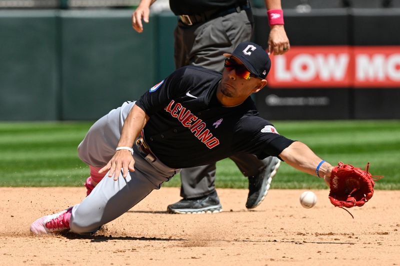 May 12, 2024; Chicago, Illinois, USA;  Cleveland Guardians second base Andrés Giménez (0) fields a ball on an attempted double play against the Chicago White Sox during the fourth inning at Guaranteed Rate Field. Mandatory Credit: Matt Marton-USA TODAY Sports