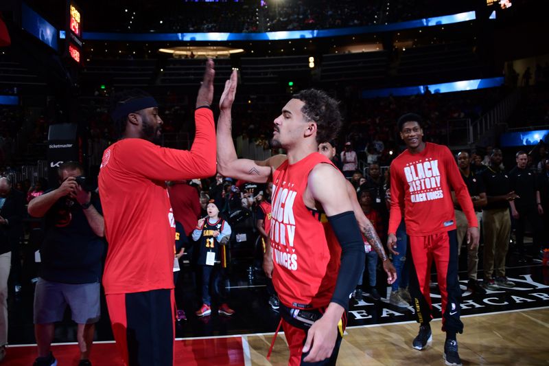 ATLANTA, GA - February 23: on Trae Young #11 of the Atlanta Hawks is introduced before the game against the Toronto Raptors February 23, 2024 at State Farm Arena in Atlanta, Georgia.  NOTE TO USER: User expressly acknowledges and agrees that, by downloading and/or using this Photograph, user is consenting to the terms and conditions of the Getty Images License Agreement. Mandatory Copyright Notice: Copyright 2024 NBAE (Photo by Scott Cunningham/NBAE via Getty Images)