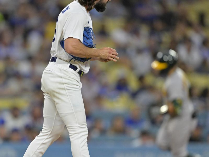 Aug 2, 2023; Los Angeles, California, USA;  Los Angeles Dodgers starting pitcher Tony Gonsolin (26) looks down on the mound after giving up a solo home run to Oakland Athletics catcher Shea Langeliers (23) in the third inning at Dodger Stadium. Mandatory Credit: Jayne Kamin-Oncea-USA TODAY Sports