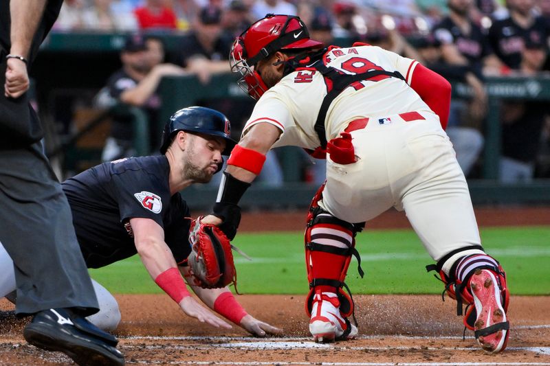 Sep 21, 2024; St. Louis, Missouri, USA;  Cleveland Guardians center fielder Lane Thomas (8) is tagged out at home by St. Louis Cardinals catcher Ivan Herrera (48) during the second inning at Busch Stadium. Mandatory Credit: Jeff Curry-Imagn Images