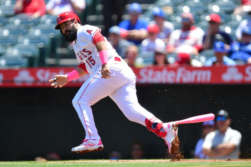 May 12, 2024; Anaheim, California, USA;  Los Angeles Angels third baseman Luis Guillorme (15) runs after hitting a double against the Kansas City Royals during the first inning at Angel Stadium. Mandatory Credit: Gary A. Vasquez-USA TODAY Sports