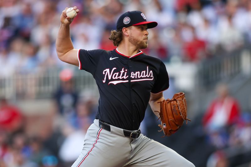 May 12, 2025; Atlanta, Georgia, USA; Washington Nationals starting pitcher Jake Irvin (27) throws against the Atlanta Braves in the first inning at Truist Park. Mandatory Credit: Brett Davis-Imagn Images