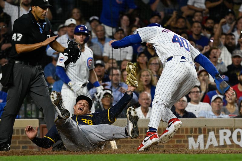 Jul 22, 2024; Chicago, Illinois, USA;  Chicago Cubs outfielder Mike Tauchman (40) scores past Milwaukee Brewers pitcher Tobias Myers (36) on a wild pitch during the fourth inning at Wrigley Field. Mandatory Credit: Matt Marton-USA TODAY Sports