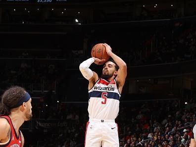 WASHINGTON, DC -? DECEMBER 13:  Tyus Jones #5 of the Washington Wizards shoots a three point basket during the game  on December 13, 2023 at Capital One Arena in Washington, DC. NOTE TO USER: User expressly acknowledges and agrees that, by downloading and or using this Photograph, user is consenting to the terms and conditions of the Getty Images License Agreement. Mandatory Copyright Notice: Copyright 2023 NBAE (Photo by Stephen Gosling/NBAE via Getty Images)