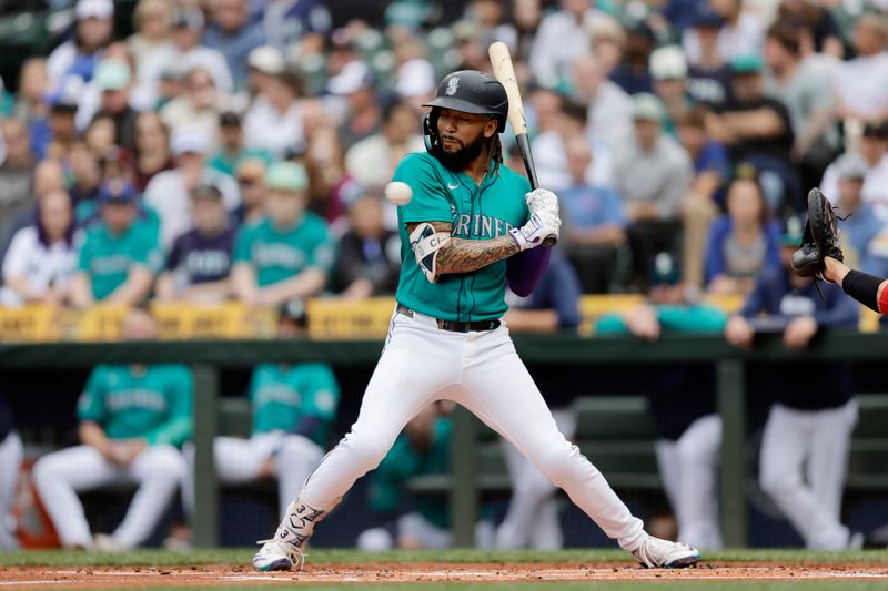 Jun 1, 2024; Seattle, Washington, USA;  Seattle Mariners shortstop J.P. Crawford (3) backs away from an inside pitch during the first inning at T-Mobile Park. Mandatory Credit: John Froschauer-USA TODAY Sports