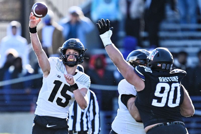 Nov 18, 2023; Evanston, Illinois, USA;  Purdue Boilermakers quarterback Ryan Browne (15) passes the ball in the fourth quarter against the Northwestern Wildcats at Ryan Field. Mandatory Credit: Jamie Sabau-USA TODAY Sports