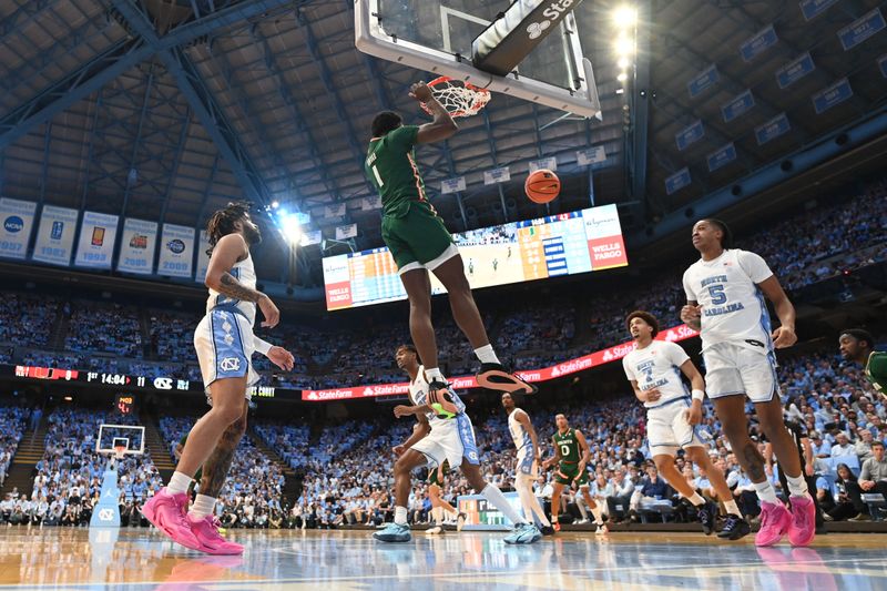 Feb 26, 2024; Chapel Hill, North Carolina, USA; Miami (Fl) Hurricanes center Michael Nwoko (1) scores in the first half at Dean E. Smith Center. Mandatory Credit: Bob Donnan-USA TODAY Sports