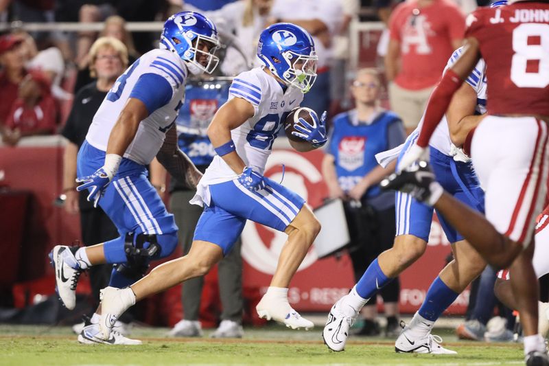 Sep 16, 2023; Fayetteville, Arkansas, USA; BYU Cougars wide receiver Parker Kingston (82) runs after a catch for a touchdown in the third quarter against the Arkansas Razorbacks at Donald W. Reynolds Razorback Stadium. BYU won 38-31. Mandatory Credit: Nelson Chenault-USA TODAY Sports