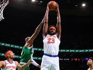 BOSTON, MA - DECEMBER 8: Mitchell Robinson #23 of the New York Knicks grabs the rebound during the game  on December 8, 2023 at the TD Garden in Boston, Massachusetts. NOTE TO USER: User expressly acknowledges and agrees that, by downloading and or using this photograph, User is consenting to the terms and conditions of the Getty Images License Agreement. Mandatory Copyright Notice: Copyright 2023 NBAE  (Photo by Brian Babineau/NBAE via Getty Images)