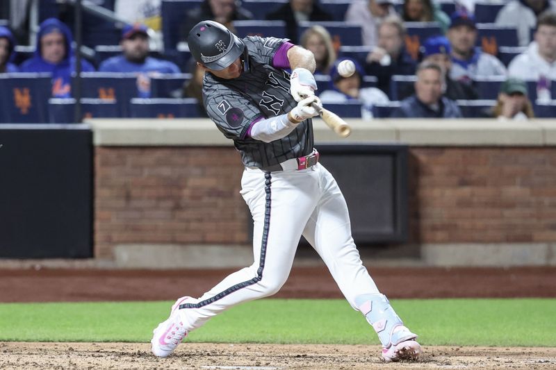May 24, 2025; New York City, New York, USA;  New York Mets first baseman Pete Alonso (20) hits a single in the seventh inning against the Los Angeles Dodgers at Citi Field. Mandatory Credit: Wendell Cruz-Imagn Images