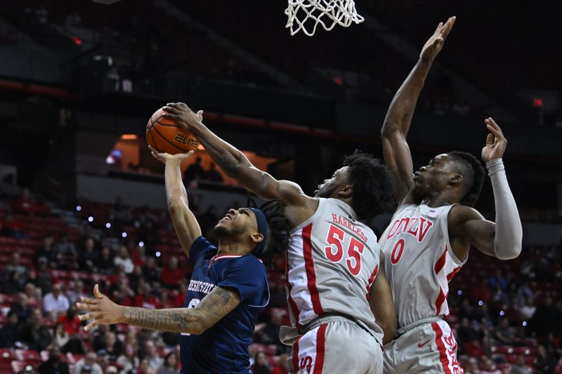 Feb 3, 2023; Las Vegas, Nevada, USA; UNLV Runnin' Rebels guard EJ Harkless (55) and forward Victor Iwuakor (0) defend against Fresno State Bulldogs guard Donavan Yap (0) in the second half at Thomas & Mack Center. Mandatory Credit: Candice Ward-USA TODAY Sports