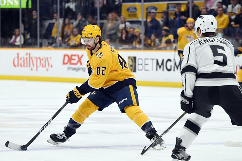 Jan 31, 2024; Nashville, Tennessee, USA; Nashville Predators center Tommy Novak (82) skates the puck into the offensive zone during the first period against the Los Angeles Kings at Bridgestone Arena. Mandatory Credit: Christopher Hanewinckel-USA TODAY Sports