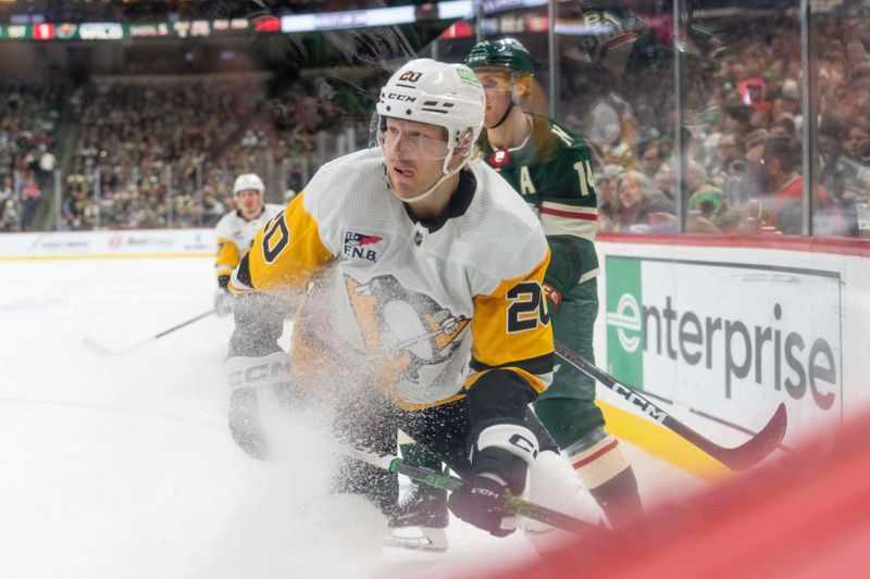 Feb 9, 2024; Saint Paul, Minnesota, USA; Pittsburgh Penguins center Lars Eller (20) makes a play along the boards against the Minnesota Wild in the first period at Xcel Energy Center. Mandatory Credit: Matt Blewett-USA TODAY Sports