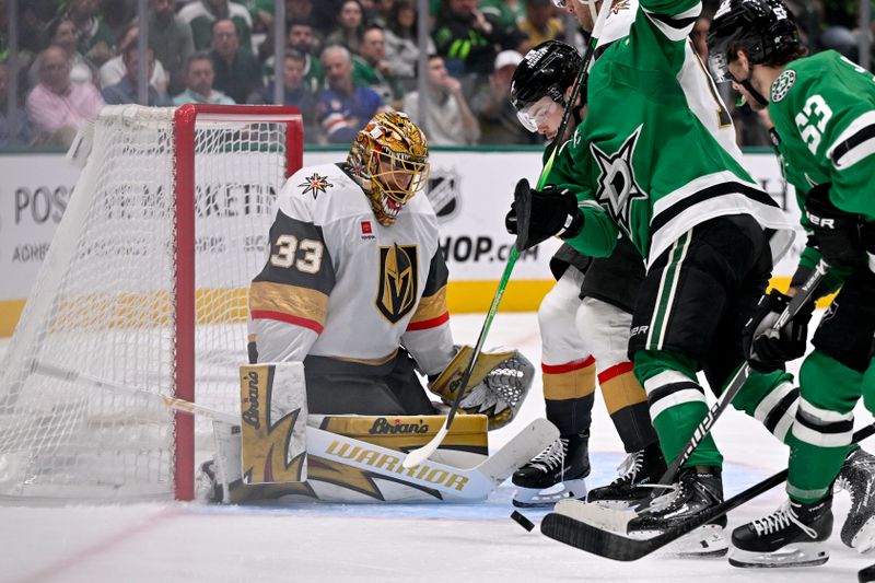 Mar 10, 2026; Dallas, Texas, USA; Vegas Golden Knights right wing Cole Smith (22) stops a shot by Dallas Stars center Mavrik Bourque (22) during the second period at the American Airlines Center. Mandatory Credit: Jerome Miron-Imagn Images