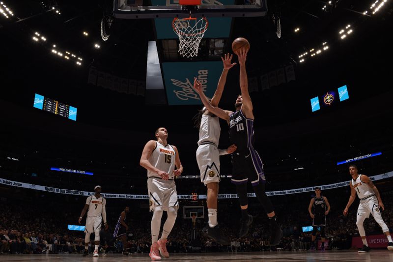 DENVER, CO - FEBRUARY 28: Domantas Sabonis #10 of the Sacramento Kings drives to the basket during the game against the Denver Nuggets on February 28, 2024 at the Ball Arena in Denver, Colorado. NOTE TO USER: User expressly acknowledges and agrees that, by downloading and/or using this Photograph, user is consenting to the terms and conditions of the Getty Images License Agreement. Mandatory Copyright Notice: Copyright 2024 NBAE (Photo by Garrett Ellwood/NBAE via Getty Images)