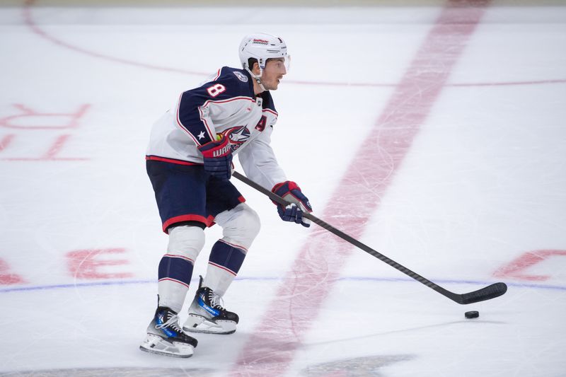 Feb 13, 2024; Ottawa, Ontario, CAN; Columbus Blue Jackets defenseman Zach Werenski (8) skates with the puck in the third period against the Ottawa Senators at the Canadian Tire Centre. Mandatory Credit: Marc DesRosiers-USA TODAY Sports