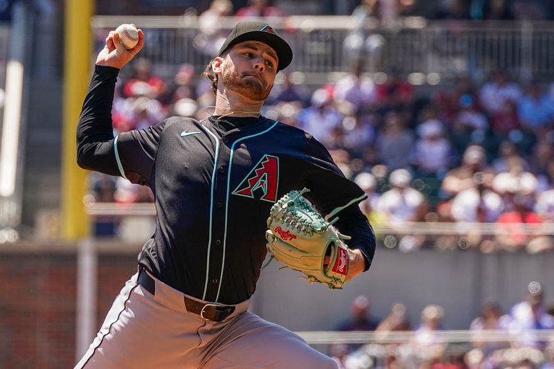 Apr 7, 2024; Cumberland, Georgia, USA; Arizona Diamondbacks starting pitcher Ryne Nelson (19) pitches against the Atlanta Braves during the first inning at Truist Park. Mandatory Credit: Dale Zanine-USA TODAY Sports