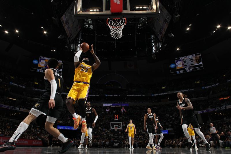 MEMPHIS, TN - MARCH 27: LeBron James #23 of the Los Angeles Lakers shoots the ball during the game against the Memphis Grizzlies on March 27, 2024 at FedExForum in Memphis, Tennessee. NOTE TO USER: User expressly acknowledges and agrees that, by downloading and or using this photograph, User is consenting to the terms and conditions of the Getty Images License Agreement. Mandatory Copyright Notice: Copyright 2024 NBAE (Photo by Joe Murphy/NBAE via Getty Images)