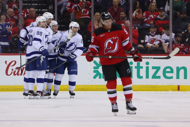 Oct 22, 2024; Newark, New Jersey, USA; The Tampa Bay Lightning celebrate a goal by defenseman Victor Hedman (77) during the second period agaionst the New Jersey Devils at Prudential Center. Mandatory Credit: Ed Mulholland-Imagn Images