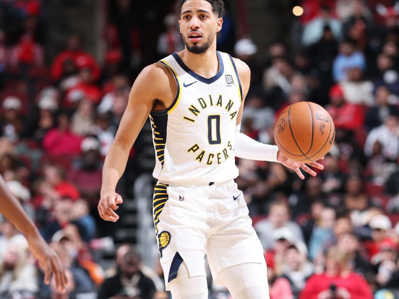 CHICAGO, IL - DECEMBER 6: Tyrese Haliburton #0 of the Indiana Pacers looks to pass the ball during the game against the Chicago Bulls on December 6, 2024 at United Center in Chicago, Illinois. NOTE TO USER: User expressly acknowledges and agrees that, by downloading and or using this photograph, User is consenting to the terms and conditions of the Getty Images License Agreement. Mandatory Copyright Notice: Copyright 2024 NBAE (Photo by Jeff Haynes/NBAE via Getty Images)