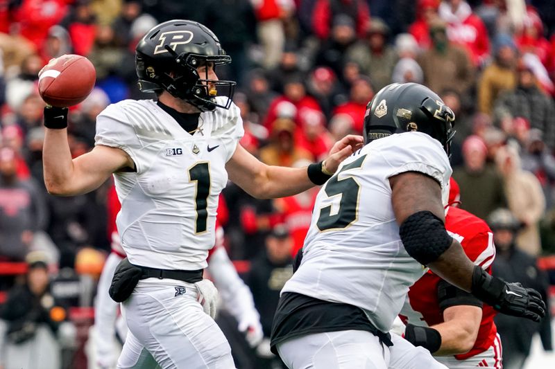 Oct 28, 2023; Lincoln, Nebraska, USA; Purdue Boilermakers quarterback Hudson Card (1) passes against the Nebraska Cornhuskers during the second quarter at Memorial Stadium. Mandatory Credit: Dylan Widger-USA TODAY Sports