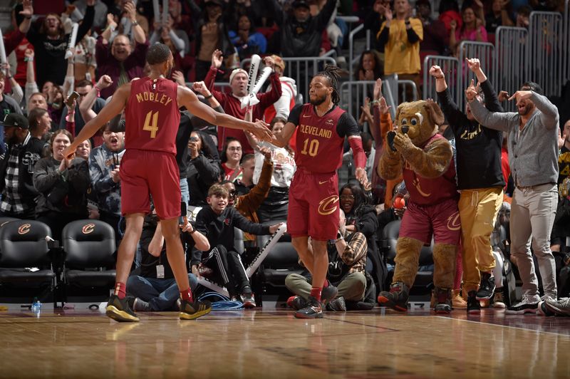 CLEVELAND, OH - FEBRUARY 14: Evan Mobley #4 and Darius Garland #10 of the Cleveland Cavaliers celebrate during the game against the Chicago Bulls on February 14, 2024 at Rocket Mortgage FieldHouse in Cleveland, Ohio. NOTE TO USER: User expressly acknowledges and agrees that, by downloading and/or using this Photograph, user is consenting to the terms and conditions of the Getty Images License Agreement. Mandatory Copyright Notice: Copyright 2024 NBAE (Photo by David Liam Kyle/NBAE via Getty Images)