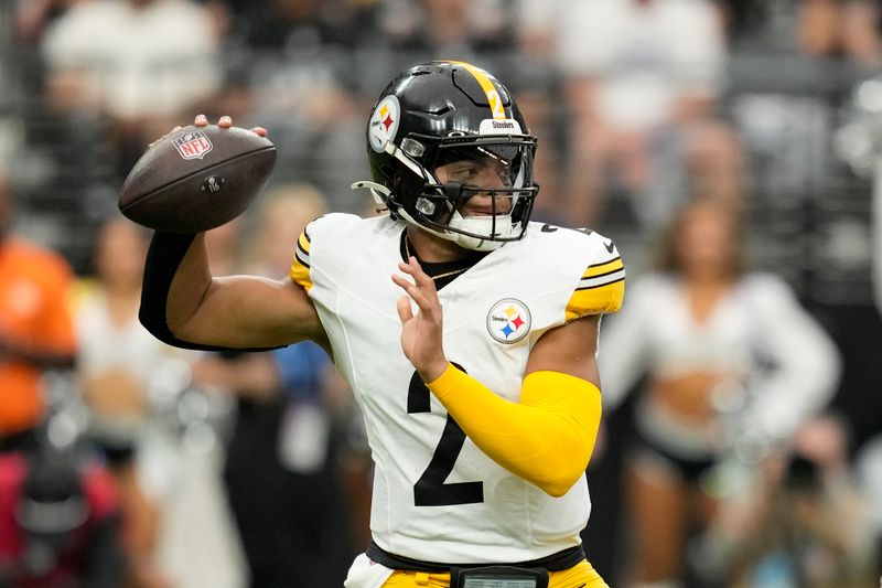 Pittsburgh Steelers quarterback Justin Fields (2) passes against the Las Vegas Raiders during the first half of an NFL football game in Las Vegas, Sunday, Oct. 13, 2024. (AP Photo/John Locher)