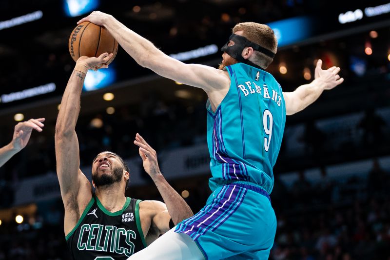 CHARLOTTE, NORTH CAROLINA - APRIL 01: Davis Bertans #9 of the Charlotte Hornets blocks a shot from Jayson Tatum #0 of the Boston Celtics in the third quarter during their game at Spectrum Center on April 01, 2024 in Charlotte, North Carolina. NOTE TO USER: User expressly acknowledges and agrees that, by downloading and or using this photograph, User is consenting to the terms and conditions of the Getty Images License Agreement. (Photo by Jacob Kupferman/Getty Images)