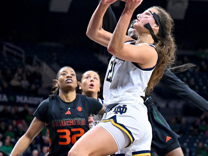 Jan 14, 2024; South Bend, Indiana, USA; Notre Dame Fighting Irish forward Maddy Westbeld (21) goes up for a shot in the first half against the Miami Hurricanes at the Purcell Pavilion. Mandatory Credit: Matt Cashore-USA TODAY Sports