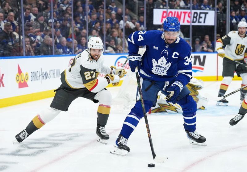 Jan 23, 2026; Toronto, Ontario, CAN; Toronto Maple Leafs center Auston Matthews (34) battles for the puck with Vegas Golden Knights defenseman Shea Theodore (27) during the third period at Scotiabank Arena. Mandatory Credit: Nick Turchiaro-Imagn Images