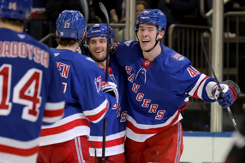 Mar 27, 2026; New York, New York, USA; New York Rangers center Jonny Brodzinski (22) celebrates his goal against the Chicago Blackhawks with right wing Jaroslav Chmelar (49) and defenseman Will Borgen (17) during the second period at Madison Square Garden. Mandatory Credit: Brad Penner-Imagn Images