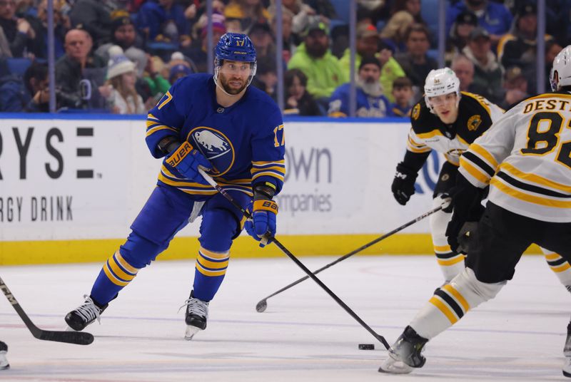 Jan 28, 2025; Buffalo, New York, USA;  Buffalo Sabres left wing Jason Zucker (17) skates up ice with the puck during the second period against the Boston Bruins at KeyBank Center. Mandatory Credit: Timothy T. Ludwig-Imagn Images