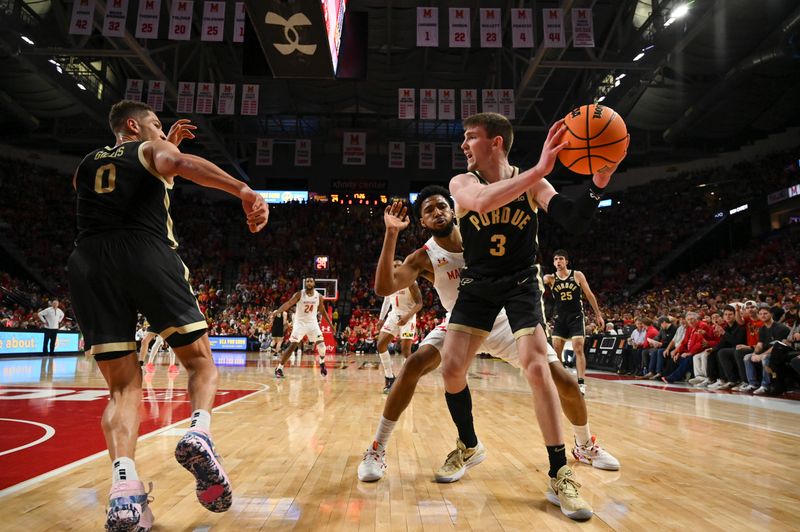 Feb 16, 2023; College Park, Maryland, USA; Purdue Boilermakers guard Braden Smith (3) looks to pass to  forward Mason Gillis (0) as Maryland Terrapins guard Don Carey (0) defends during the second half at Xfinity Center. Maryland Terrapins defeated Purdue Boilermakers 68-54. Mandatory Credit: Tommy Gilligan-USA TODAY Sports