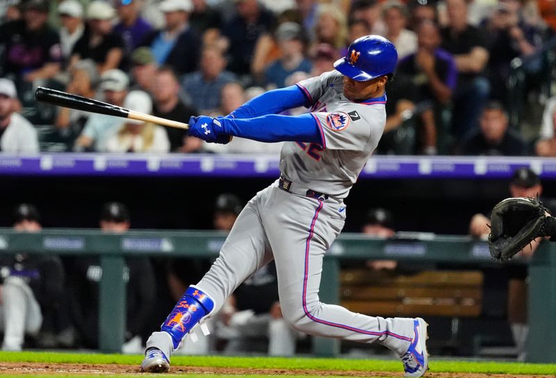 Jun 7, 2025; Denver, Colorado, USA; New York Mets right fielder Juan Soto (22) singles in the seventh iinning against the Colorado Rockies at Coors Field. Mandatory Credit: Ron Chenoy-Imagn Images