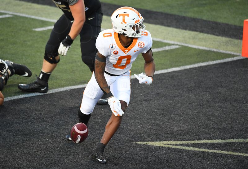 Dec 12, 2020; Nashville, Tennessee, USA; Tennessee Volunteers defensive back Bryce Thompson (0) returns an interception for a touchdown during the first half against the Vanderbilt Commodores at Vanderbilt Stadium. Mandatory Credit: Christopher Hanewinckel-USA TODAY Sports