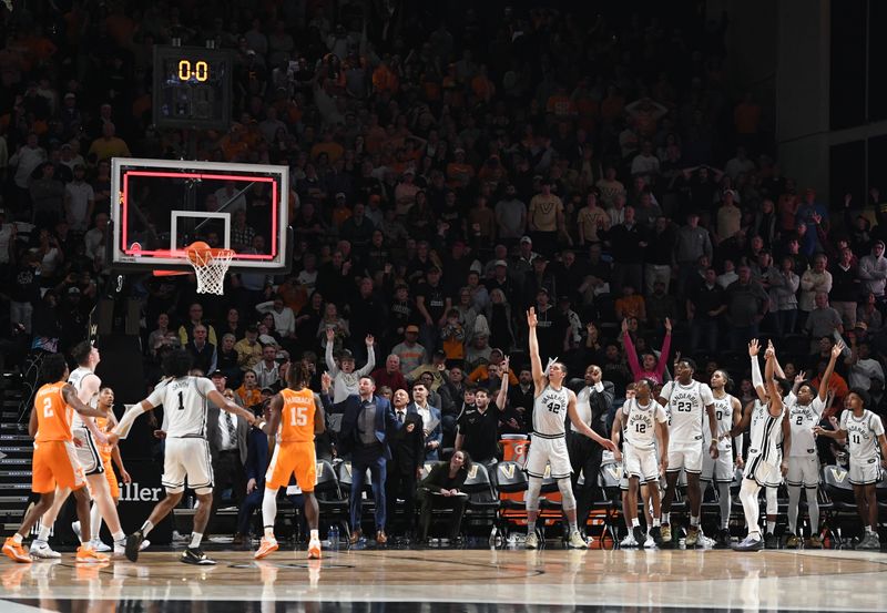 Feb 8, 2023; Nashville, Tennessee, USA; Vanderbilt Commodores guard Tyrin Lawrence (0) makes the game-winning three-pointer at the buzzer to bear the Tennessee Volunteers at Memorial Gymnasium. Mandatory Credit: Christopher Hanewinckel-USA TODAY Sports