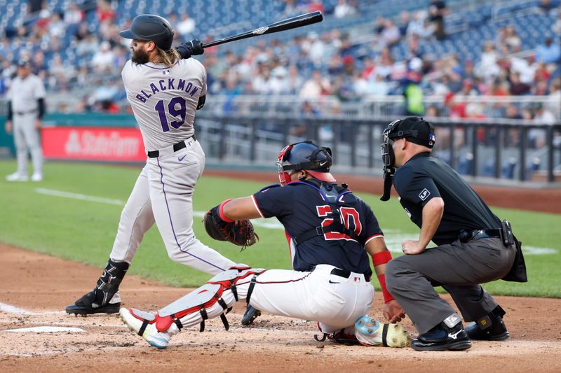 Aug 21, 2024; Washington, District of Columbia, USA; Colorado Rockies outfielder Charlie Blackmon (19) singles against the Washington Nationals during the third inning at Nationals Park. Mandatory Credit: Geoff Burke-USA TODAY Sports