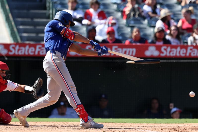 Sep 29, 2024; Anaheim, California, USA;  Texas Rangers center fielder Leody Taveras (3) breaks his bat during the ninth inning against the Los Angeles Angels at Angel Stadium. Mandatory Credit: Kiyoshi Mio-Imagn Images