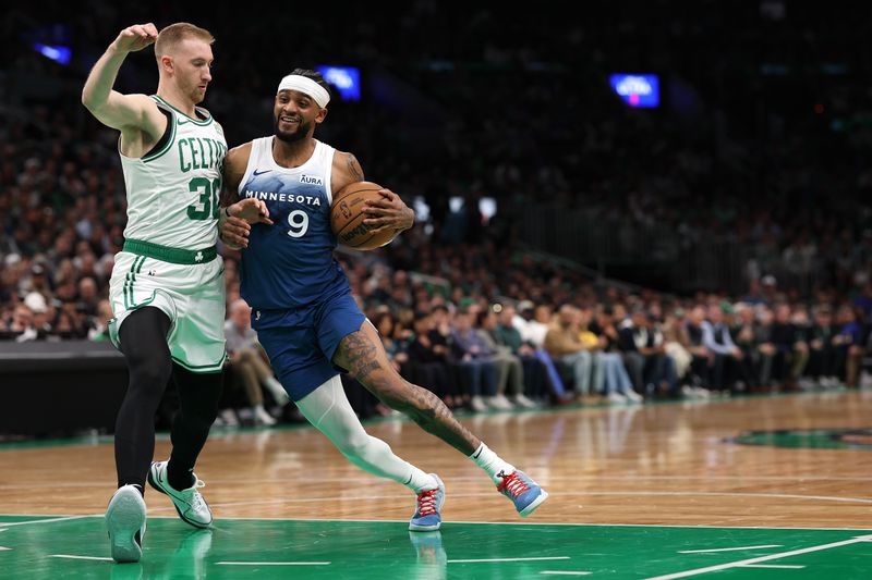 BOSTON, MASSACHUSETTS - JANUARY 10: Sam Hauser #30 of the Boston Celtics defends Nickeil Alexander-Walker #9 of the Minnesota Timberwolves during the first quarter at TD Garden on January 10, 2024 in Boston, Massachusetts. NOTE TO USER: User expressly acknowledges and agrees that, by downloading and or using this photograph, user is consenting to the terms and conditions of the Getty Images License Agreement.  (Photo by Maddie Meyer/Getty Images)