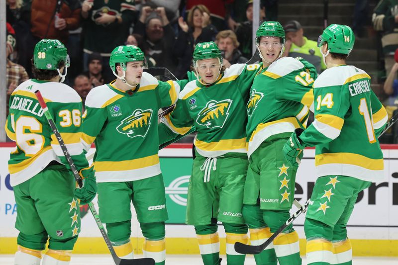 Jan 4, 2023; Saint Paul, Minnesota, USA; Minnesota Wild left wing Kirill Kaprizov (97) celebrates his goal with teammates during the second period against the Tampa Bay Lightning at Xcel Energy Center. Mandatory Credit: Bruce Fedyck-USA TODAY Sports